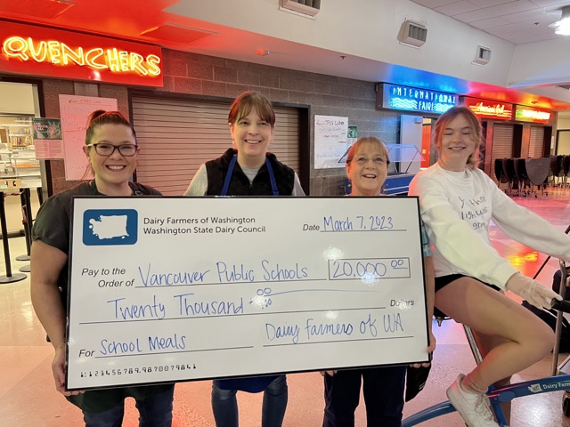 Nutrition Services staff, Jennifer and Shana, and Kitchen Manager Cheryl, join ASB student Dotty to celebrate the Dairy Council and Seattle Seahawks Hometown Grant.